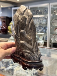 A Chinese Lingbi stone scholar's rock on wooden stand, Yun Tai 雲台 mark, 19/20th C.