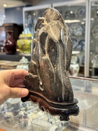 A Chinese Lingbi stone scholar's rock on wooden stand, Yun Tai 雲台 mark, 19/20th C.
