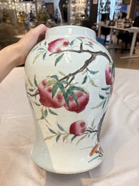 A Chinese famille rose 'nine peaches' vase and cover, 19th C.