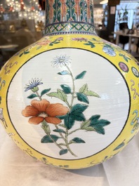 A large Chinese famille rose yellow-ground 'tianqiu ping' vase with flowers and antiquities, 19th C.