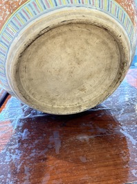 A large Chinese famille rose coral-red-ground fish bowl with narrative design, 19th C.