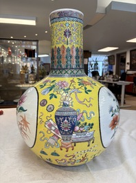 A large Chinese famille rose yellow-ground 'tianqiu ping' vase with flowers and antiquities, 19th C.