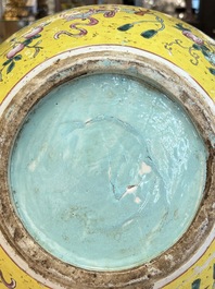 A large Chinese famille rose yellow-ground 'tianqiu ping' vase with flowers and antiquities, 19th C.