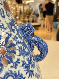 A Chinese blue, white and copper-red 'hu' vase with lotus scrolls, Qianlong mark, 19th C.