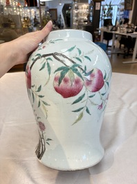 A Chinese famille rose 'nine peaches' vase and cover, 19th C.