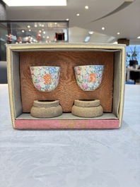 A pair of Chinese famille rose 'millefleurs' cups with a presentation box, Jiaqing mark, Republic