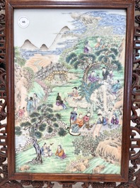 A Chinese famille rose 'gathering of sages' plaque, mounted in a wooden frame, Republic