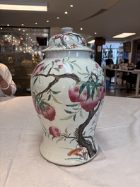 A Chinese famille rose 'nine peaches' vase and cover, 19th C.