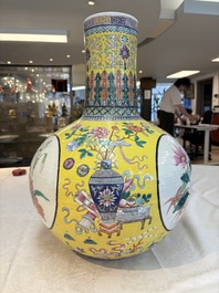 A large Chinese famille rose yellow-ground 'tianqiu ping' vase with flowers and antiquities, 19th C.