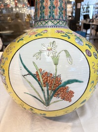 A large Chinese famille rose yellow-ground 'tianqiu ping' vase with flowers and antiquities, 19th C.