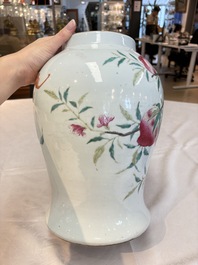 A Chinese famille rose 'nine peaches' vase and cover, 19th C.