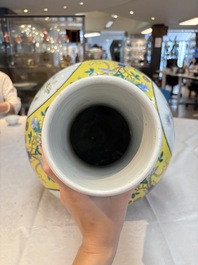 A large Chinese famille rose yellow-ground 'tianqiu ping' vase with flowers and antiquities, 19th C.