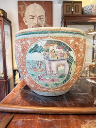 A large Chinese famille rose coral-red-ground fish bowl with narrative design, 19th C.