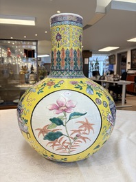 A large Chinese famille rose yellow-ground 'tianqiu ping' vase with flowers and antiquities, 19th C.