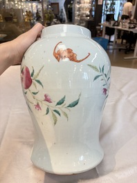 A Chinese famille rose 'nine peaches' vase and cover, 19th C.