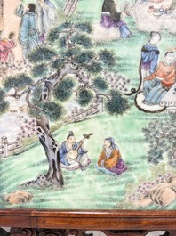 A Chinese famille rose 'gathering of sages' plaque, mounted in a wooden frame, Republic