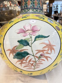 A large Chinese famille rose yellow-ground 'tianqiu ping' vase with flowers and antiquities, 19th C.