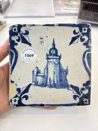 Two blue and white Dutch Delft 'castle' and 'soldier with coloured flame' tiles, 17th C.