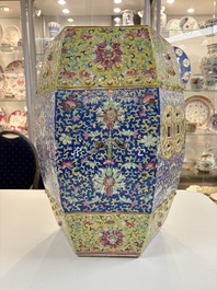 A Chinese famille rose blue and yellow-ground hexagonal garden seat, 19th C.