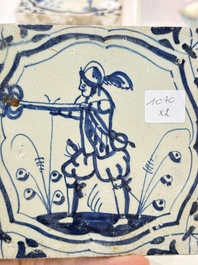 Two blue and white Dutch Delft 'soldier with coloured flame' tiles, 17th C.