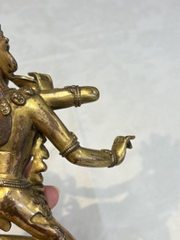 A Nepalese or Tibetan turquoise-inlaid gilt-bronze sculpture of Kurukulla or Red Tara, 15th C. or later