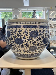 A massive Chinese blue and white 'lotus scroll' fish bowl, Qianlong/Jiaqing