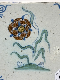 Two polychrome Dutch Delft 'flower' tiles, 17th C.