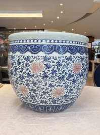 A fine Chinese blue, white and copper-red 'lotus scroll' fish bowl, Qianlong