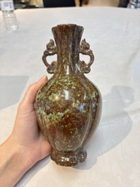A Chinese celadon-glazed vase and a faux bronze-glazed vase, Qianlong mark, 18/19th C.