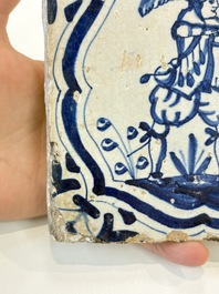 Two blue and white Dutch Delft 'soldier with coloured flame' tiles, 17th C.