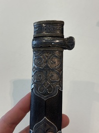 A Caucasian walrus bone-hilted kindjal with niello silver mounts, 19th C.