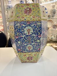 A Chinese famille rose blue and yellow-ground hexagonal garden seat, 19th C.