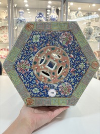 A Chinese famille rose blue and yellow-ground hexagonal garden seat, 19th C.