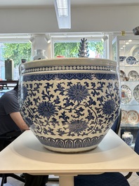 A massive Chinese blue and white 'lotus scroll' fish bowl, Qianlong/Jiaqing