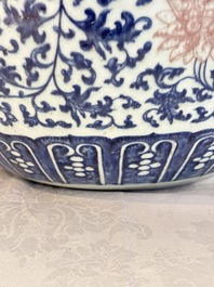 A fine Chinese blue, white and copper-red 'lotus scroll' fish bowl, Qianlong