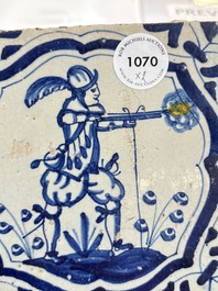 Two blue and white Dutch Delft 'soldier with coloured flame' tiles, 17th C.