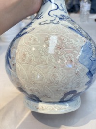 A Chinese blue, white and copper-red garlic-mouth vase with mythical animals, Kangxi mark, 19th C.