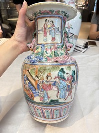 A pair of Chinese famille rose vases with narrative design on wooden stands, 19th C.