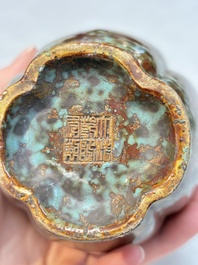 A Chinese celadon-glazed vase and a faux bronze-glazed vase, Qianlong mark, 18/19th C.