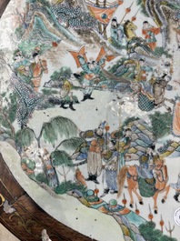 A Chinese mother-of-pearl-inlaid hongmu table with a circular Canton famille verte 'warriors on horseback' plaque, 19th C.