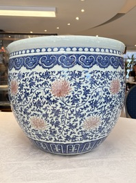 A fine Chinese blue, white and copper-red 'lotus scroll' fish bowl, Qianlong