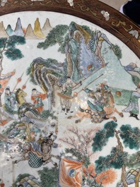 A Chinese mother-of-pearl-inlaid hongmu table with a circular Canton famille verte 'warriors on horseback' plaque, 19th C.