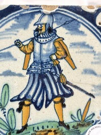 A polychrome Dutch Delft maiolica 'soldier' ​​medallion tile, late 16th C.