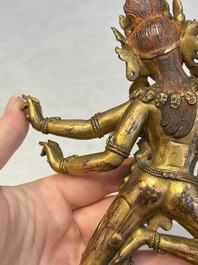 A Nepalese or Tibetan turquoise-inlaid gilt-bronze sculpture of Kurukulla or Red Tara, 15th C. or later