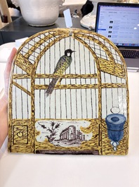 A polychrome Dutch Delft 'bird cage' plaque, 18th C.