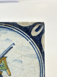 A polychrome Dutch Delft maiolica 'soldier' medallion tile, late 16th C.