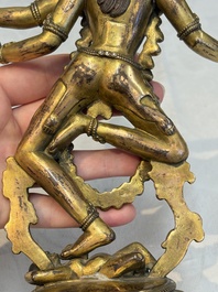 A Nepalese or Tibetan turquoise-inlaid gilt-bronze sculpture of Kurukulla or Red Tara, 15th C. or later