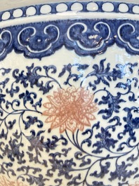 A fine Chinese blue, white and copper-red 'lotus scroll' fish bowl, Qianlong