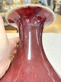 A large Chinese flamb&eacute;-glazed 'yuhuchunping' vase on a wooden stand, 19th C.