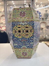 A Chinese famille rose blue and yellow-ground hexagonal garden seat, 19th C.